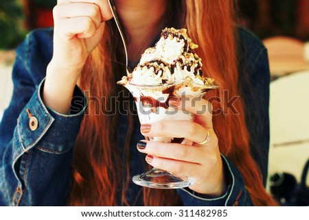 eating dessert close up. woman tasting creamy dessert