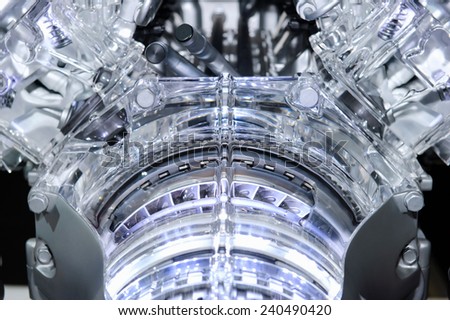 Car engine. Concept of modern automobile motor with metal, chrome, plastic and glass parts with lights.