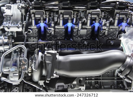 Powerful engine with metal, chrome, steel, plastic parts and blue lights of automobile race motor