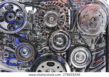 Car engine. Fragment of modern automobile motor with metal and chrome steel parts