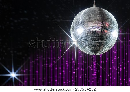 Disco ball with stars in nightclub with striped violet and black walls lit by spotlight