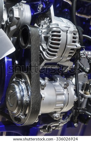 Engine with metal, plastic, rubber parts, stars on chrome details and blue coating for commercial trucks, powerful SUV and cargo vehicles, automotive transport industry