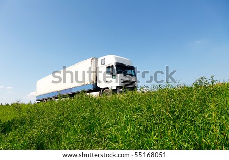 White truck driving on the road