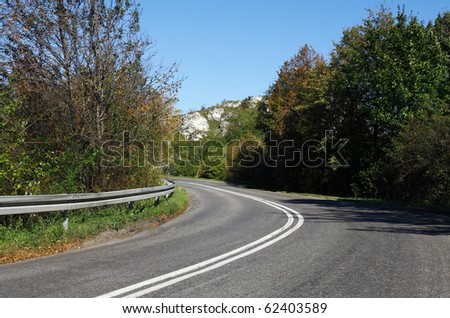 Empty curved road,blue sky