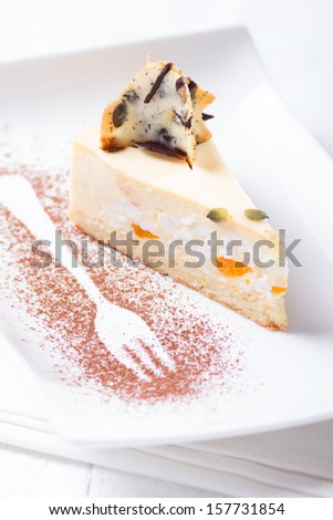 Cottage cheese and fruit cake, focus on decoration tongue