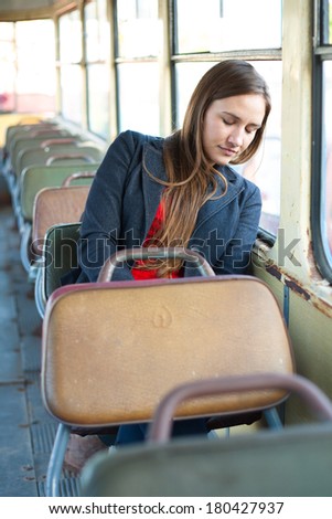 Sleepy woman resting in vintage bus