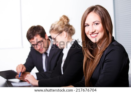 Happy smiling woman in business meeting