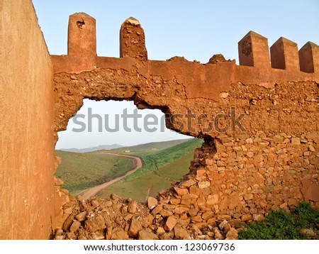 Break down the wall, the freedom is outside / Broken wall and road to freedom. (morocco)