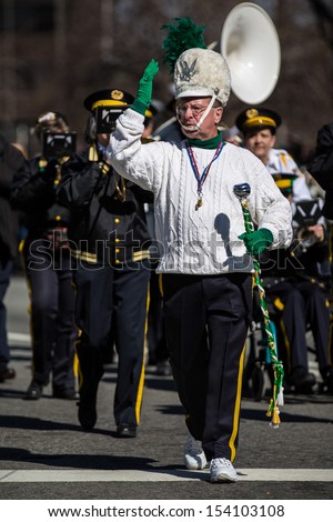 MORRISTOWN, NJ - MARCH 9: The leader of a brass-band formation dressed in traditional Irish uniform parade at the Saint Patrick's Day festival on March 9, 2013 in Morristown, NJ, USA.