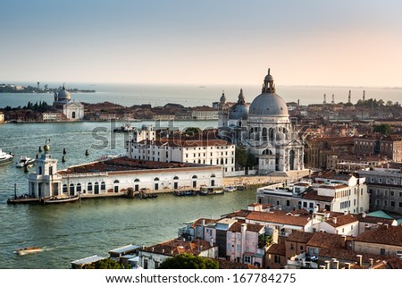 VENICE, ITALY - JULY 26: Late afternoon aerial view over Venice towards the Grand Canal and the St Maria of Salute Basilica on July 26, 2013 in Venice Italy.