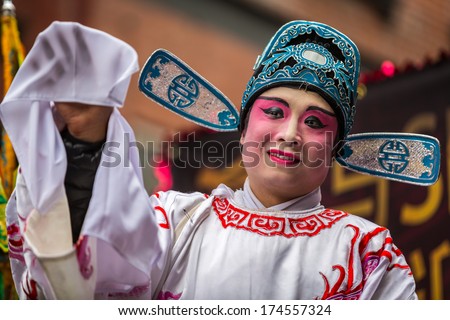 New York - February 2, 2014: Chinese Man Wearing Makeup Parades At The Lunar New Year Festival In Chinatown.