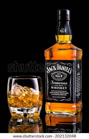 CHATHAM, NJ, UNITED STATES - JULY 1, 2014: Jack Daniel\'s whiskey bottle and glass. Jack Daniel\'s is a brand of sour mash Tennessee whiskey and the highest selling American whiskey in the world.