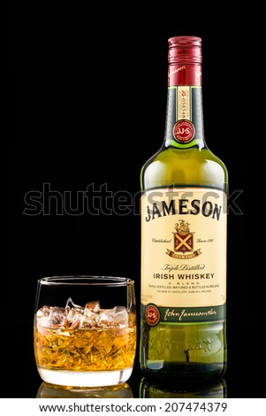 CHATHAM, NJ, UNITED STATES - JULY 26, 2014: Glass and bottle of Jameson Irish Whiskey. Jameson is by far the best selling Irish whiskey in the world, with over 48 million bottles sold annually.