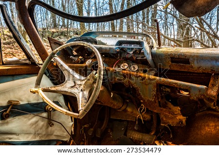 Interior of an old rusty car abandoned in a New Jersey forest (HDR look)
