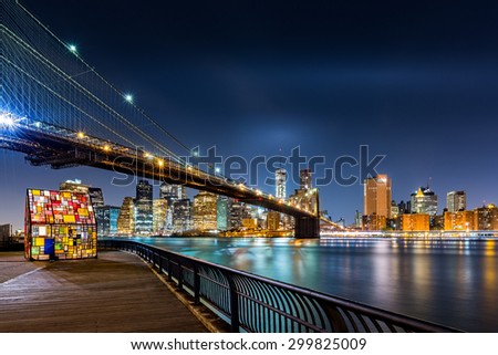 Brooklyn Bridge and the Lower Manhattan skyline by night as viewed from  Brooklyn Bridge Park in New York City