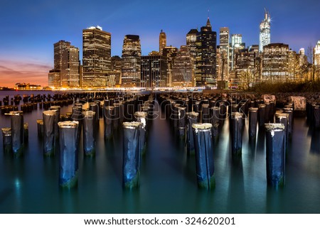 New York Financial District with Freedom Tower still under construction and an old Brooklyn pier