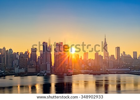 Midtown Manhattan skyline at sunrise, as viewed from Weehawken, along the 42nd street canyon