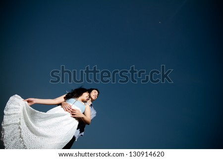 An in love young couple in romantic emotion under the moonlight