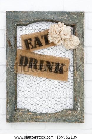 Old picture frame with eat and drink labels