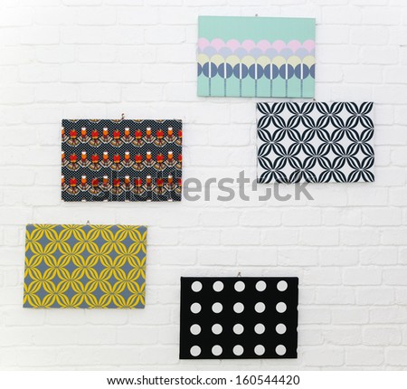 Wall decoration with pattern cardboard on white brick wall background