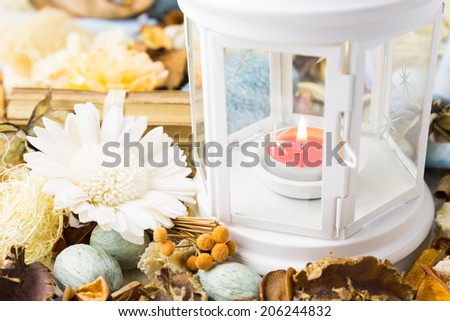 Dried flowers with lamp and candle for scented perfume aroma therapy
