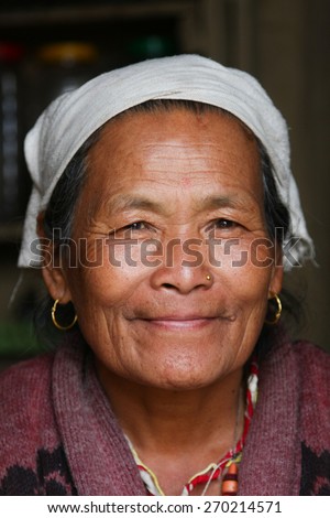 KATHMANDU, NEPAL-DECEMBER, 2009 - An unidentified nepalese woman doing their daily life duty along the street in summer