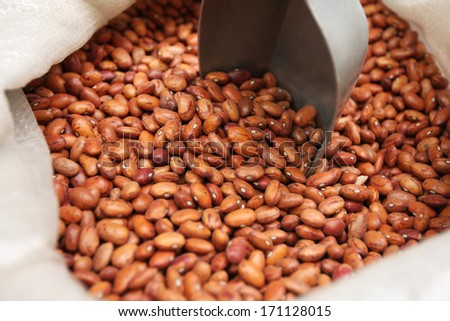 Brown beans in a bag, in a food market.