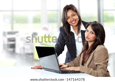 Smiling Indian Business Women In Front A Laptop At Office
