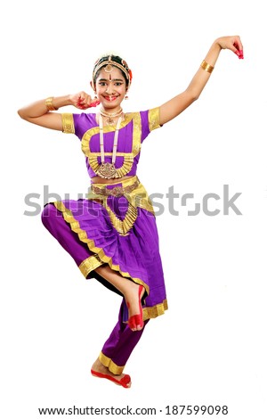Indian female performing Bharathanatyam doing the action of depicting Lord Ganesha in violet color costumes Indian female performing Bharathanatyam doing the action of depicting Lord Ganesha in violet color costumes