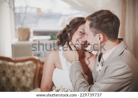 Laughing bride and groom