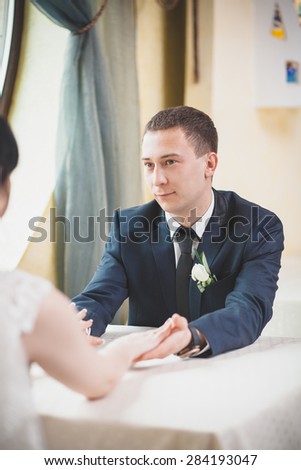 groom looking at bride wedding impression look