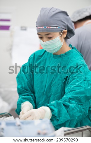 anesthesia nurse preparing tools for anesthesia doctor