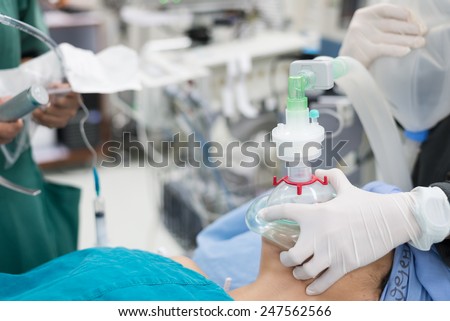 holding oxygen mask and prepare for endotracheal tube