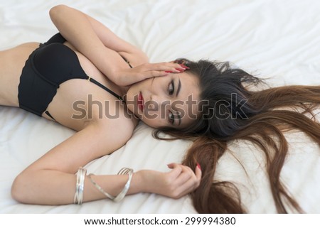 asian woman sleep on bed