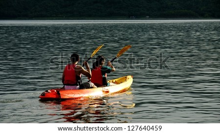 Two Kayakers with Life Vests or Life Jackets.