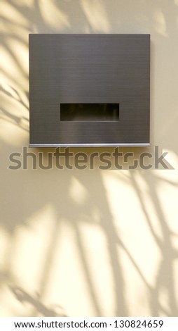 Modern Post Box with Tree Shadow on Wall