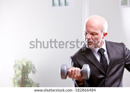 weightlifting business man in action looking at his shot