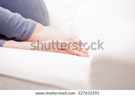 clean feet of a young woman sleeping on a white couch