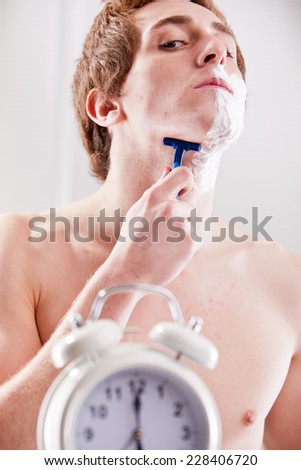 young man preparing to go to work in a hurry creating a little gag/situation