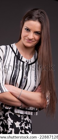 A long-haired beautiful self-confident woman posing