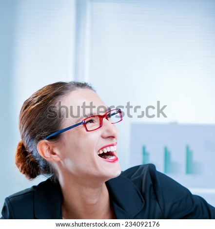 happy slim businesswoman laughing with open mouth
