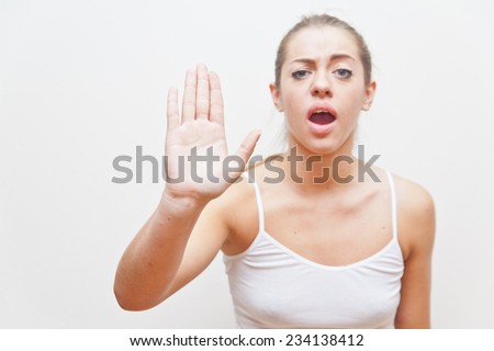 this theatrical gesture of this girl means she commands you to stop immediately