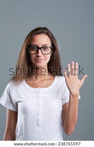 beautiful girl showing number five with fingers of one hand