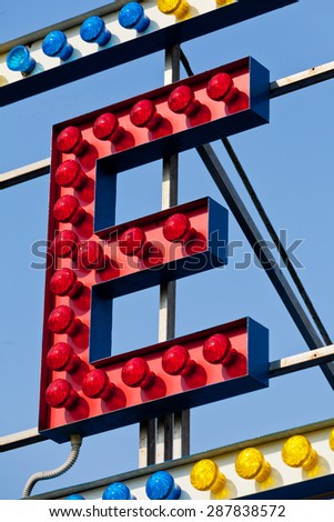classic electric sign like the ones used in circus or old fashioned shops representing the E letter