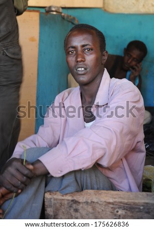 HARGEISA, SOMALIA - JANUARY 8, 2010: Khat  - light stimulant drug, is widely distributed in  Somalia . Khat uses up to 90% of the total male population. Men use Khat during a meeting in a cafe.
