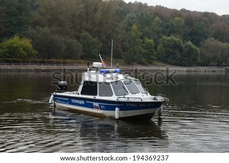 MOSCOW, RUSSIA - SEPTEMBER 16, 2013:Russian police keeps order on the waterways of the country, ensuring  safety of vacationers and preventing accidents. Water police patrol boat on the Moscow River