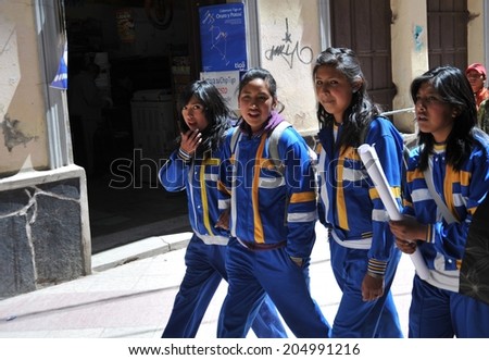 POTOSI, BOLIVIA - SEPTEMBER 8, 2010: Potosi  is one of  highest cities in  world. History City is closely connected with extraction of rich deposits of silver. Unidentified girls on  street of Potosi.