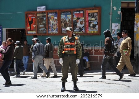 POTOSI, BOLIVIA - SEPTEMBER 8, 2010: Potosi  is one of the highest cities in  world. History City is closely connected with extraction of rich deposits of silver. Police on a city street.