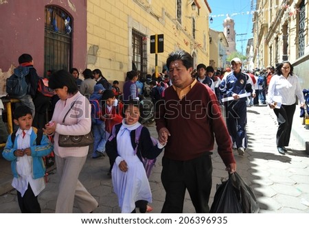 POTOSI, BOLIVIA - SEPTEMBER 8, 2010: Potosi  is one of the highest cities in  world. History City is closely connected with extraction of rich deposits of silver. Local inhabitants on the city streets