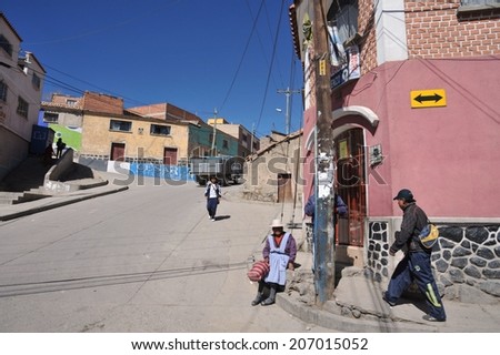 POTOSI, BOLIVIA - SEPTEMBER 7, 2010: Potosi  is one of the highest cities in  world. History City is closely connected with extraction of rich deposits of silver. Local inhabitants on the city streets